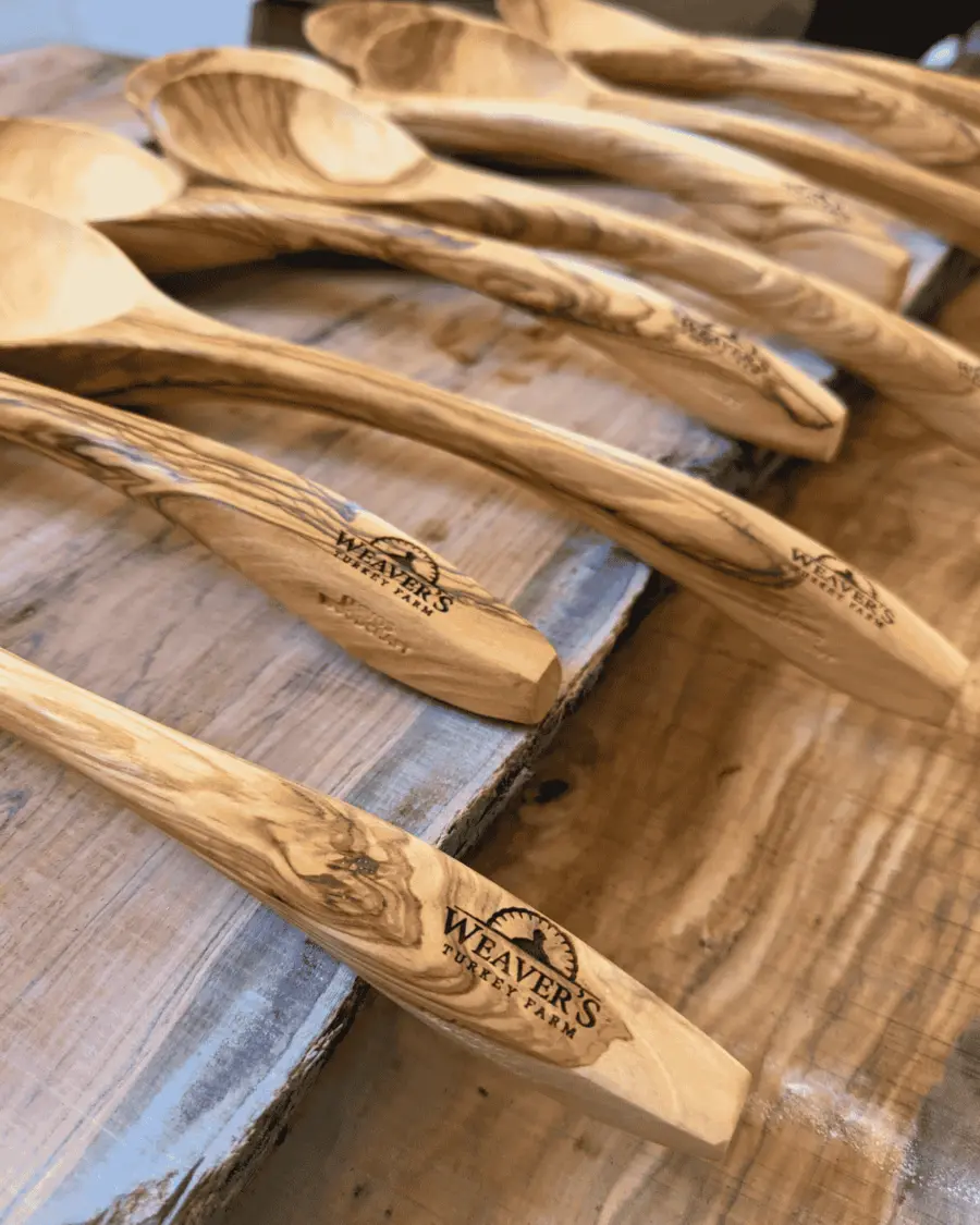 Olive wood spoons laser-engraved with the Weaver's Turkey Farm logo