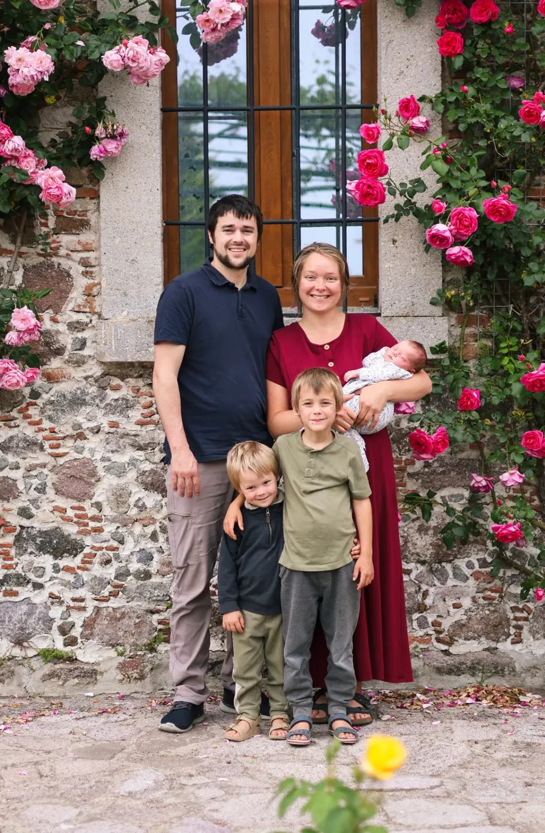 Randall, founder of Lesvos Woodcraft, with his family outside their home in Greece