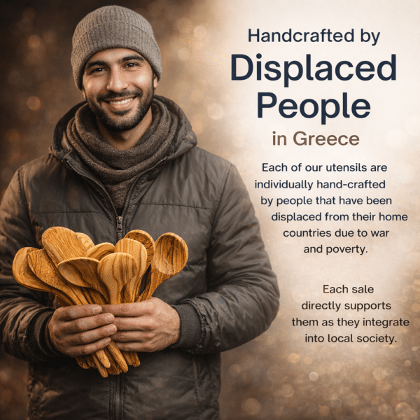 Portrait of a smiling artisan in Greece holding hand-carved olive wood cooking utensils, representing Lesvos Woodcraft’s mission of employing displaced people to create handcrafted kitchenware and support ethical, purpose-driven craftsmanship.